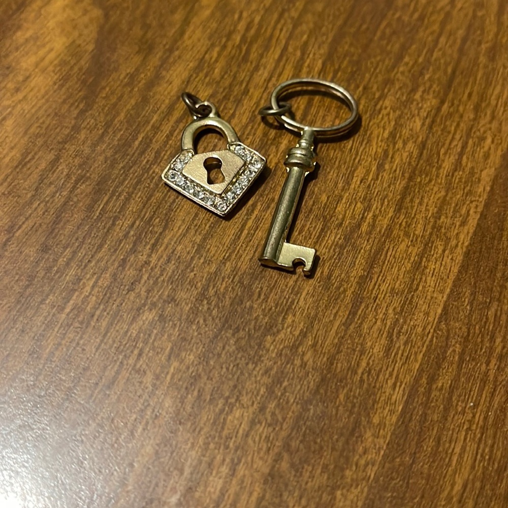 Gold tone key and lock necklace charms